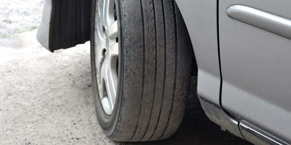 Worn tire on car